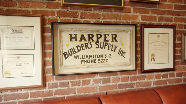 Harper Construction Sign on a brick wall