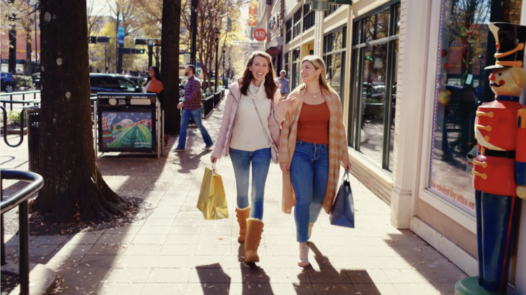 two girls walking down Main Street in Greenville, South Carolina